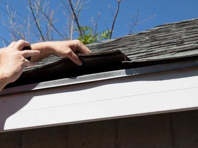 Istck Roofer Examining Water Damaged Roof 2